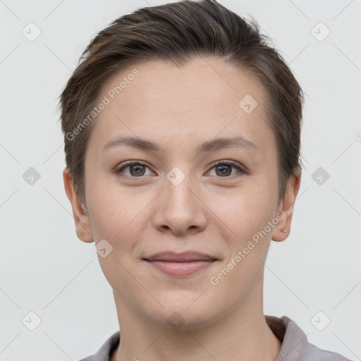 Joyful white young-adult female with short  brown hair and grey eyes