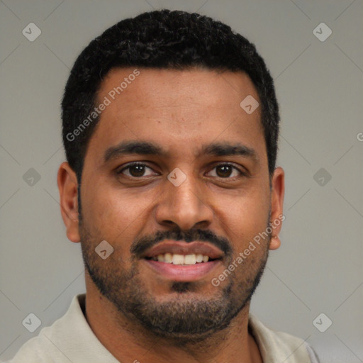 Joyful black young-adult male with short  black hair and brown eyes