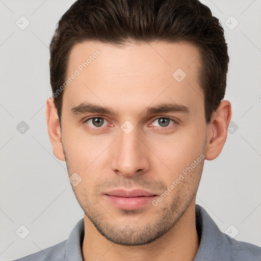 Neutral white young-adult male with short  brown hair and brown eyes