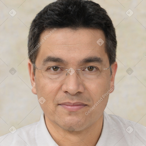 Joyful white adult male with short  black hair and brown eyes