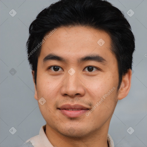 Joyful asian young-adult male with short  black hair and brown eyes