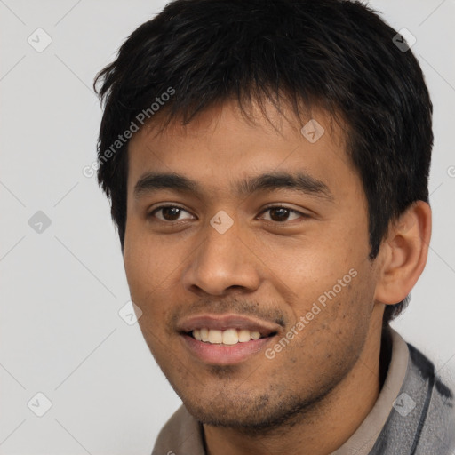 Joyful asian young-adult male with short  black hair and brown eyes