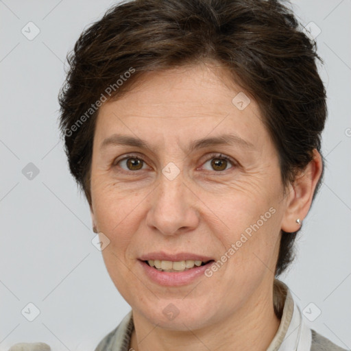 Joyful white adult female with short  brown hair and brown eyes