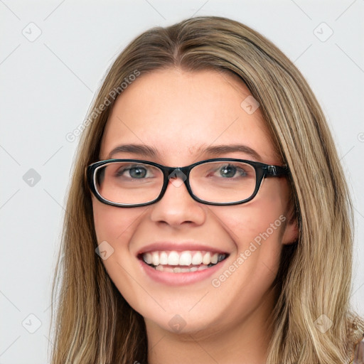 Joyful white young-adult female with long  brown hair and green eyes