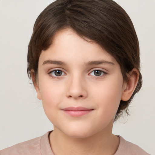 Joyful white child female with medium  brown hair and brown eyes