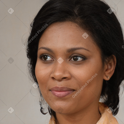 Joyful black adult female with long  brown hair and brown eyes