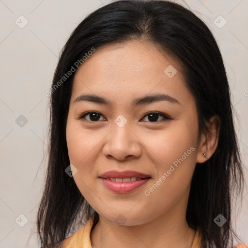 Joyful asian young-adult female with medium  brown hair and brown eyes