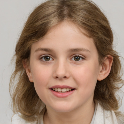 Joyful white child female with medium  brown hair and grey eyes