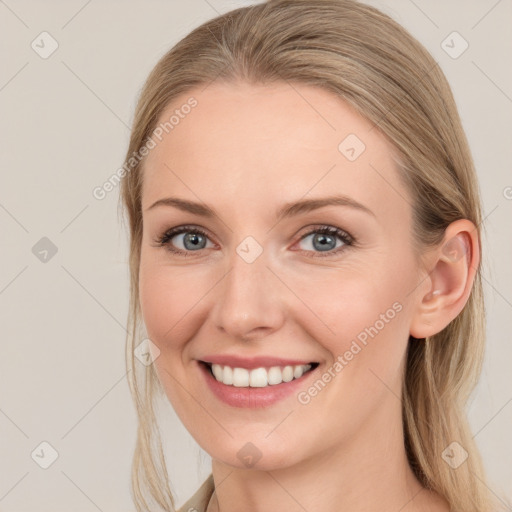 Joyful white young-adult female with long  brown hair and grey eyes