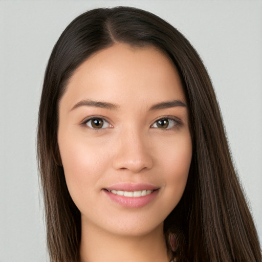 Joyful white young-adult female with long  brown hair and brown eyes