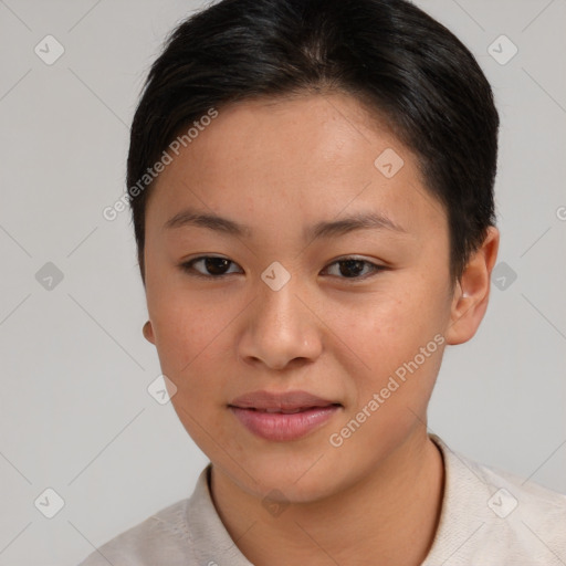 Joyful asian young-adult female with short  brown hair and brown eyes