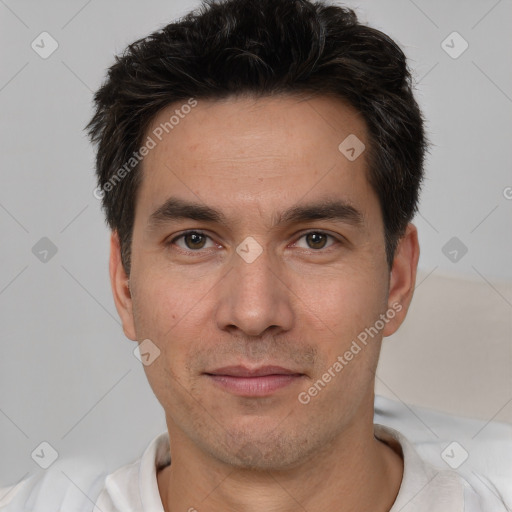 Joyful white adult male with short  black hair and brown eyes