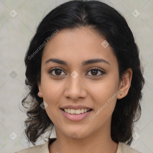 Joyful latino young-adult female with medium  brown hair and brown eyes