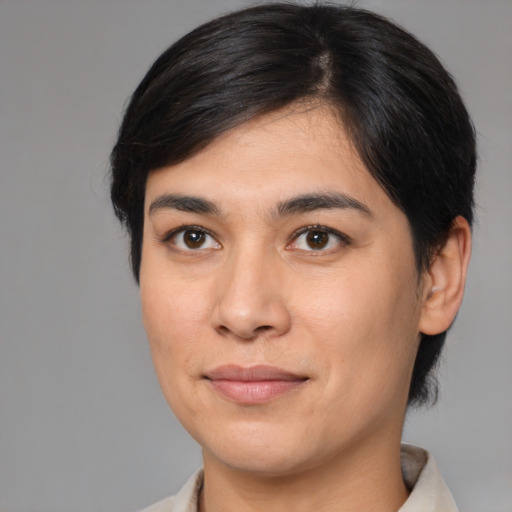 Joyful latino young-adult female with medium  brown hair and brown eyes