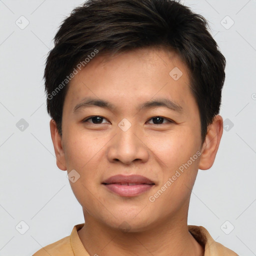 Joyful asian young-adult male with short  brown hair and brown eyes