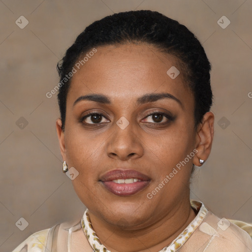 Joyful black young-adult female with short  black hair and brown eyes