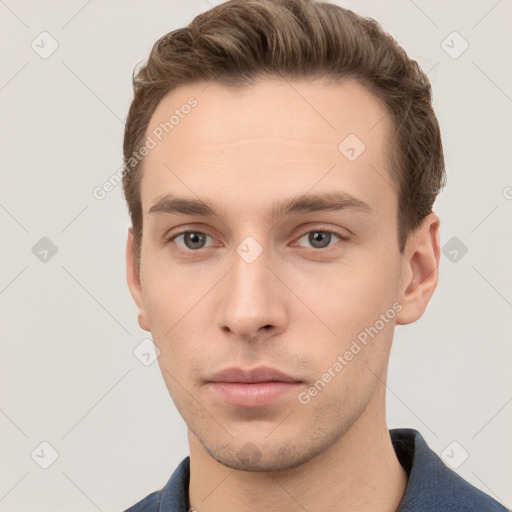 Neutral white young-adult male with short  brown hair and grey eyes