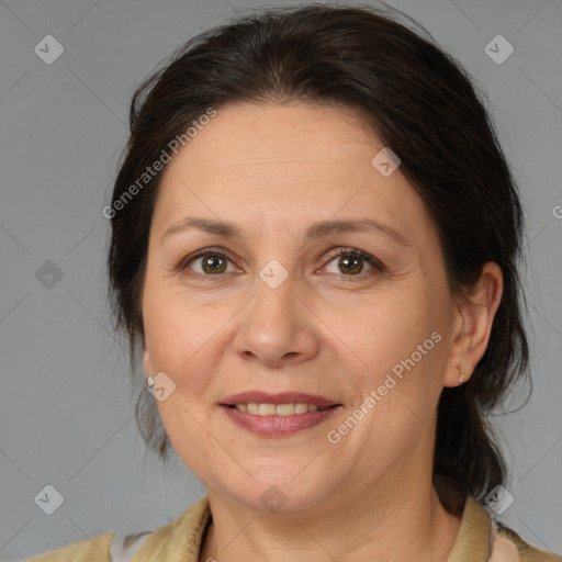 Joyful white adult female with medium  brown hair and brown eyes