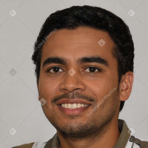 Joyful latino young-adult male with short  black hair and brown eyes