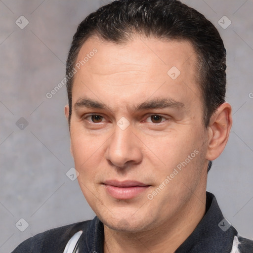 Joyful white adult male with short  brown hair and brown eyes