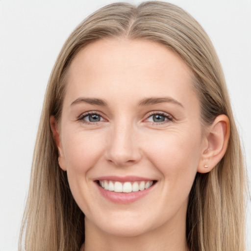 Joyful white young-adult female with long  brown hair and grey eyes