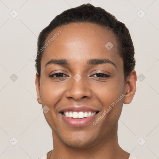 Joyful latino young-adult female with short  brown hair and brown eyes