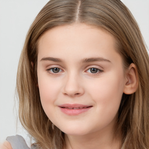 Joyful white child female with long  brown hair and brown eyes