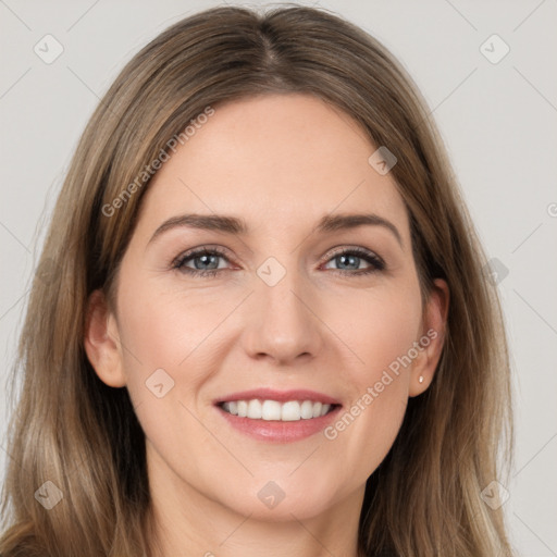 Joyful white young-adult female with long  brown hair and grey eyes