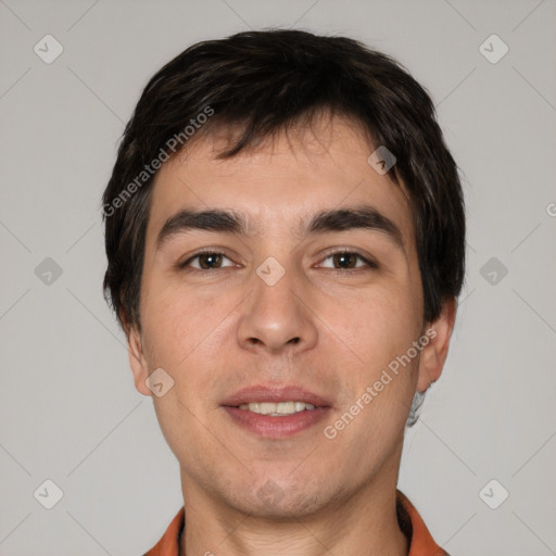 Joyful white young-adult male with short  black hair and brown eyes