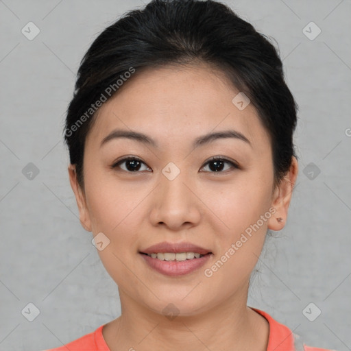 Joyful asian young-adult female with short  brown hair and brown eyes