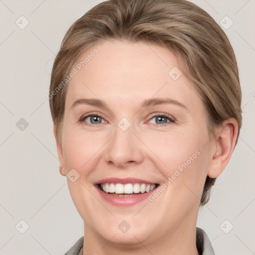 Joyful white young-adult female with short  brown hair and grey eyes