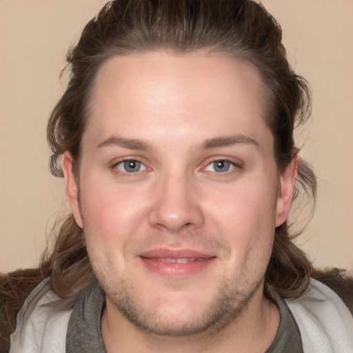 Joyful white adult male with medium  brown hair and grey eyes