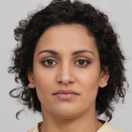 Neutral latino young-adult female with long  brown hair and brown eyes