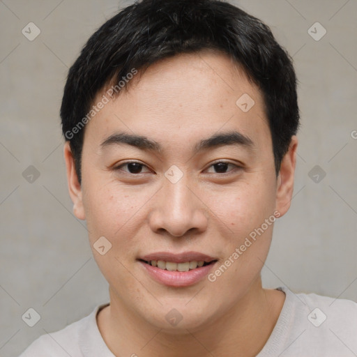 Joyful asian young-adult male with short  brown hair and brown eyes