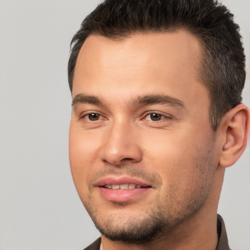 Joyful white young-adult male with short  brown hair and brown eyes