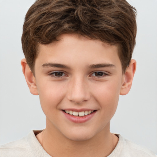 Joyful white child male with short  brown hair and brown eyes