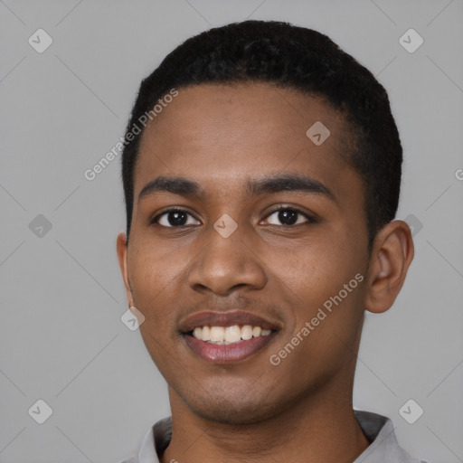 Joyful black young-adult male with short  black hair and brown eyes