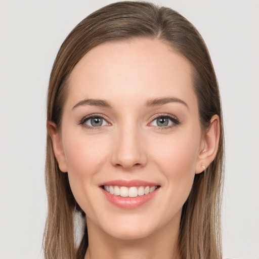 Joyful white young-adult female with long  brown hair and grey eyes