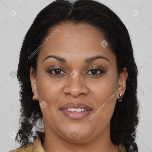 Joyful latino adult female with medium  brown hair and brown eyes