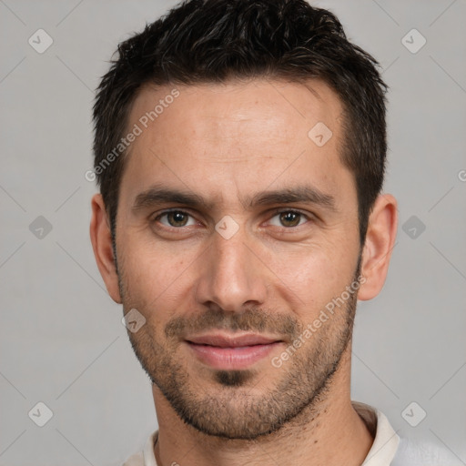 Joyful white young-adult male with short  black hair and brown eyes