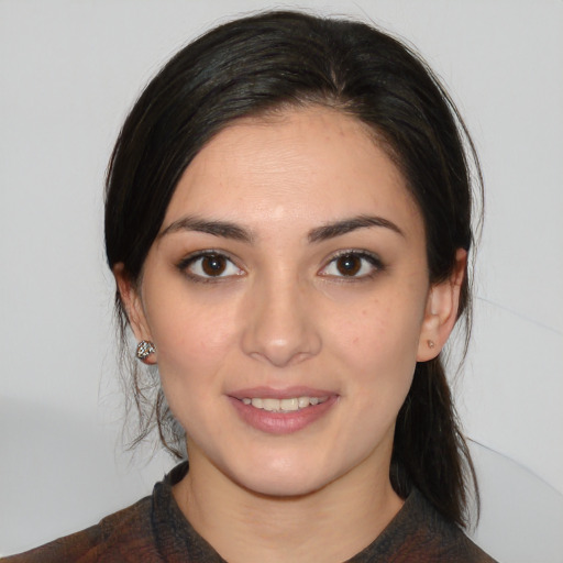 Joyful white young-adult female with medium  black hair and brown eyes