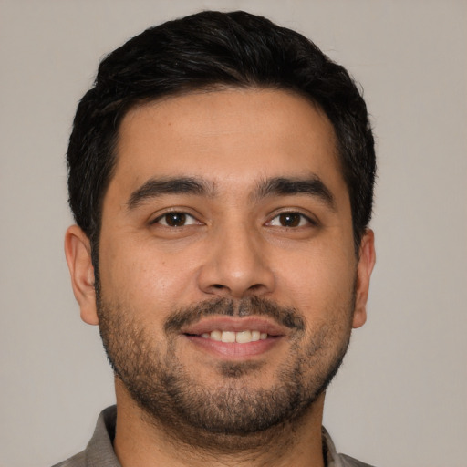 Neutral latino young-adult male with short  black hair and brown eyes