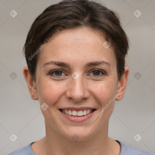 Joyful white young-adult female with short  brown hair and grey eyes