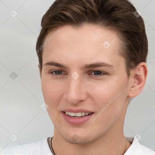 Joyful white young-adult female with short  brown hair and grey eyes