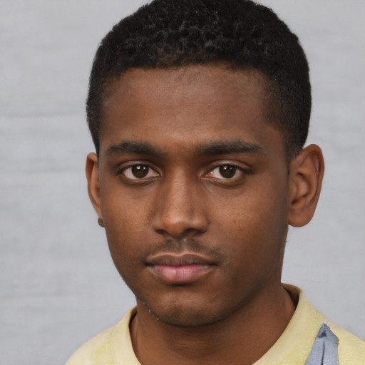 Neutral black young-adult male with short  black hair and brown eyes