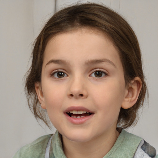 Joyful white child female with medium  brown hair and grey eyes