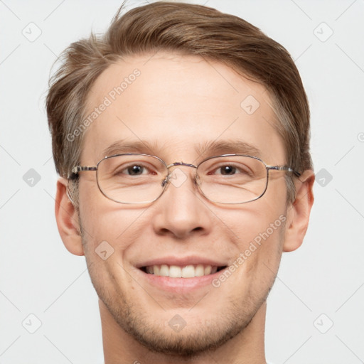 Joyful white adult male with short  brown hair and grey eyes