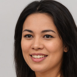 Joyful asian young-adult female with long  brown hair and brown eyes