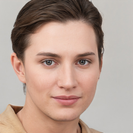 Joyful white young-adult female with short  brown hair and grey eyes