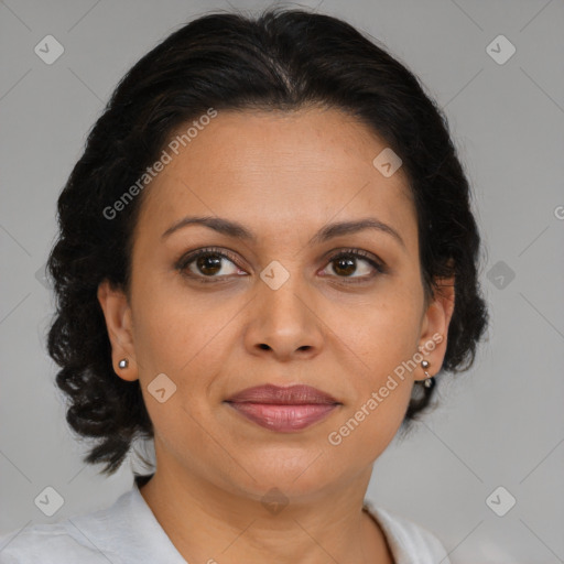 Joyful latino adult female with medium  brown hair and brown eyes